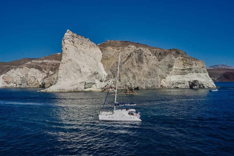 Santorini: Caldera Classic Catamaran Cruise w/ Meal & Drinks - Passing the Akrotiri Lighthouse and Indian Face Mountain