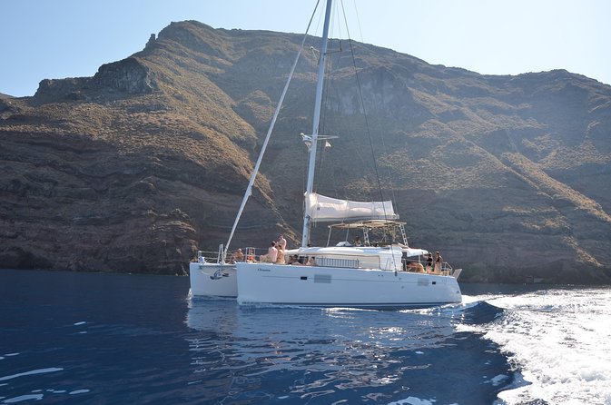 Santorini Caldera Gold Day Cruise with BBQ on board and Open Bar - The lighthouse, Black Mountain, and Indian Rock