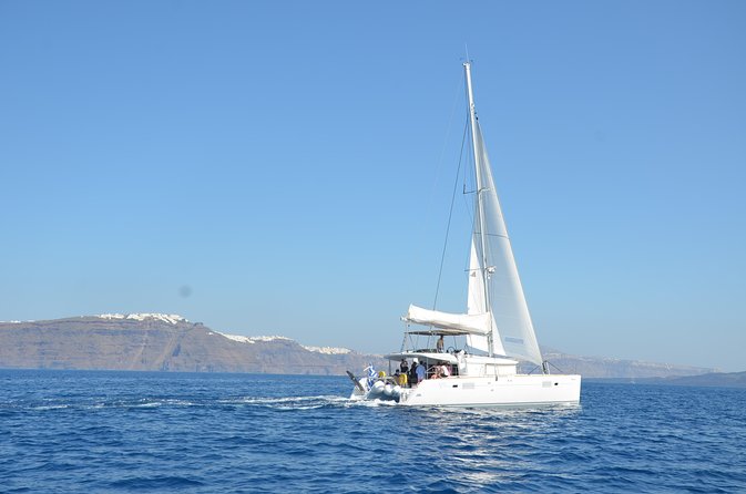 Santorini Caldera Gold Day Cruise with BBQ on board and Open Bar - Pickup, group size, and practical details