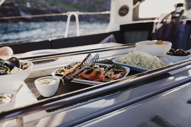 Santorini Caldera Private Sailing Boat Cruise - Akrotiri Lighthouse and the rough southern coast