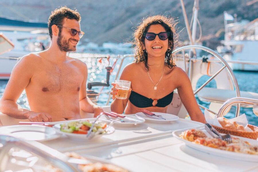 Santorini Caldera: Sunset Sailing Cruise with Meal - The lighthouse and Indian Rock