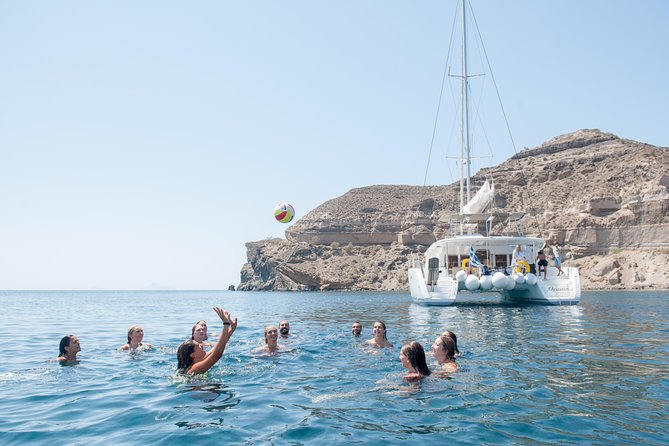 Santorini Catamaran Cruise with Fresh Meal and Open Bar - Mesa Pigadia, Indian Rock, and the black cliffs