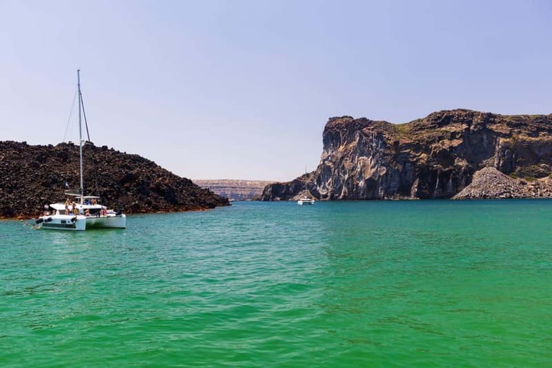 Santorini: Catamaran Cruise with Fresh Meal & Open Bar - Swimming at Black Mountain and Akrotiri Lighthouse