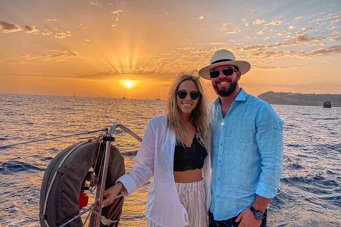 Santorini Catamaran Cruise with Greek Meal, Open-Bar and Sunset - Red Beach, snorkeling, and the south coast