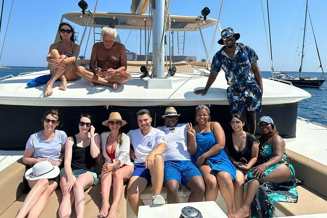 Santorini Catamaran Cruise: with Lunch, BBQ, Open Bar, Transfers - Red Beach and Santorini’s volcanic shoreline