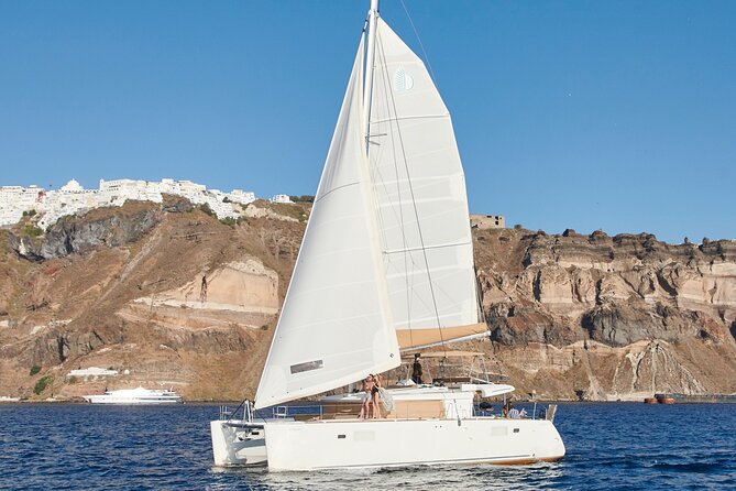 Santorini Gold Catamaran Cruise with BBQ, Drinks and Hotel Pickup - Morning or afternoon: choose the mood you want