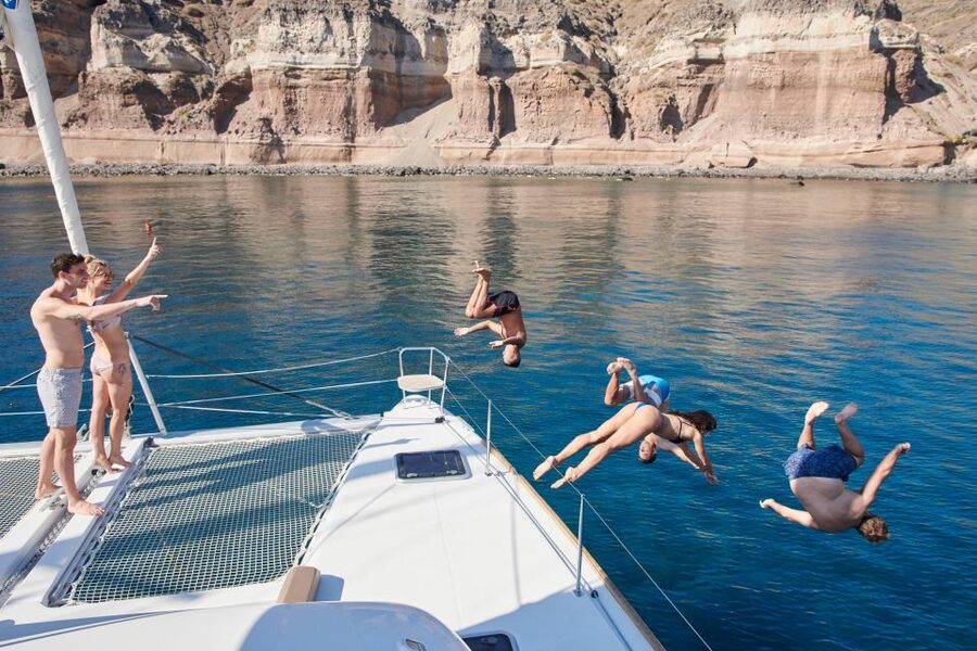 Santorini Gold Catamaran Cruise with Snorkel, BBQ & Open Bar - Why see Santorini from a catamaran?