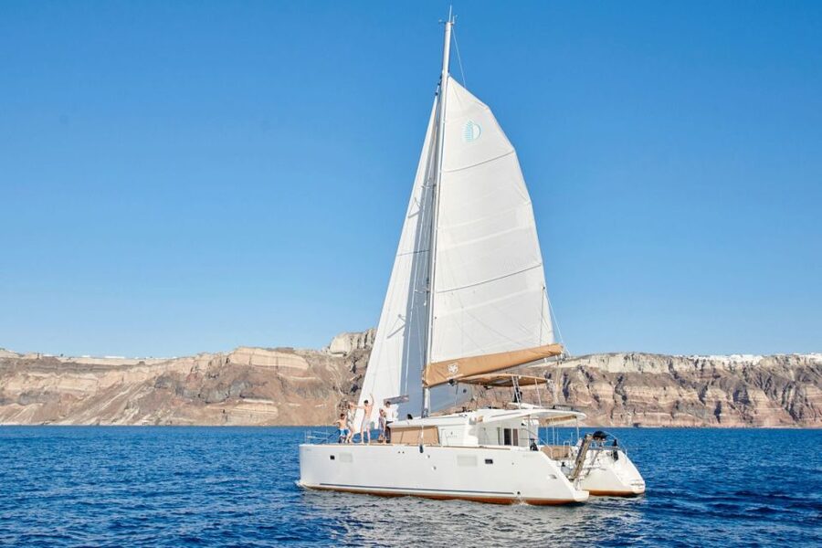 Santorini Gold Catamaran Cruise with Snorkel, BBQ & Open Bar - Caldera cliffs from the sea