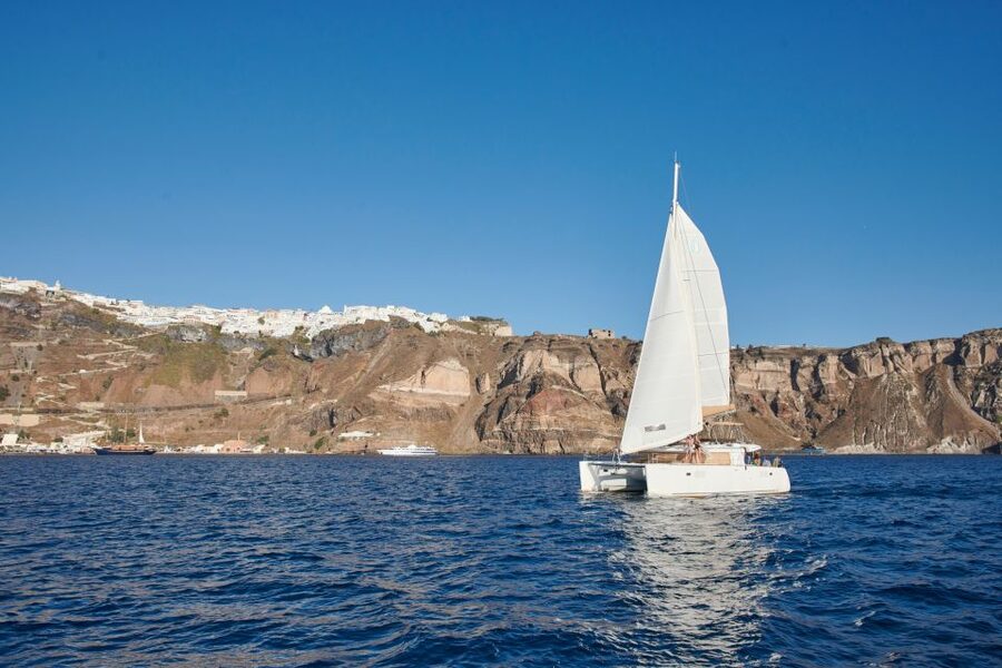 Santorini Gold Catamaran Cruise with Snorkel, BBQ & Open Bar - Mesa Pigadia and the onboard BBQ