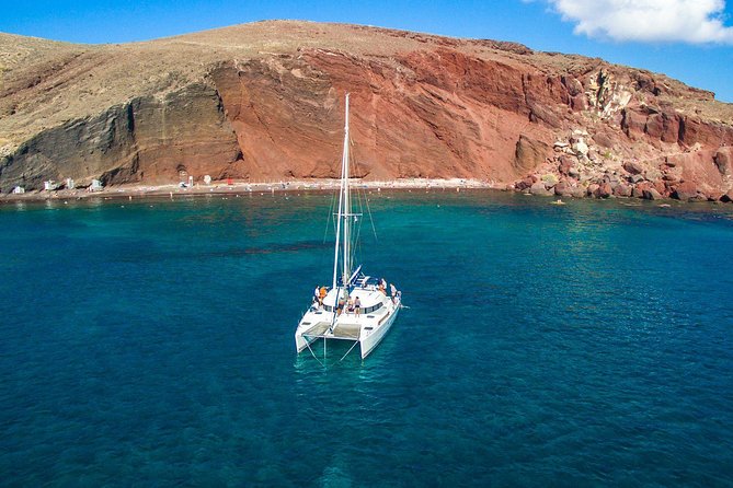 Santorini Half Day Catamaran Private Cruise incl. Meal, Drinks & Free Transport - Seeing Santorini from a private catamaran