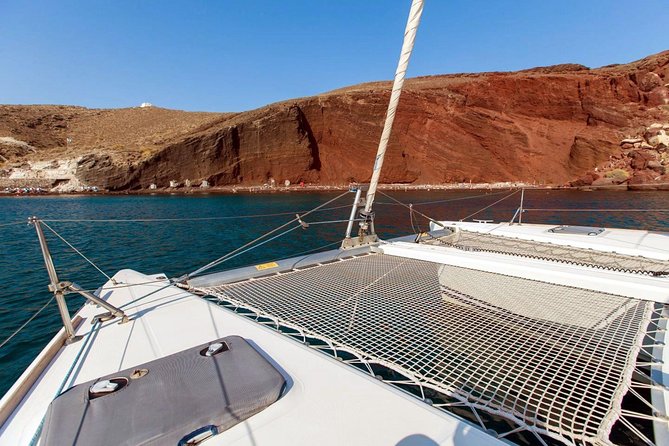 Santorini Half Day Catamaran Private Cruise incl. Meal, Drinks & Free Transport - Greek lunch, drinks, and service onboard