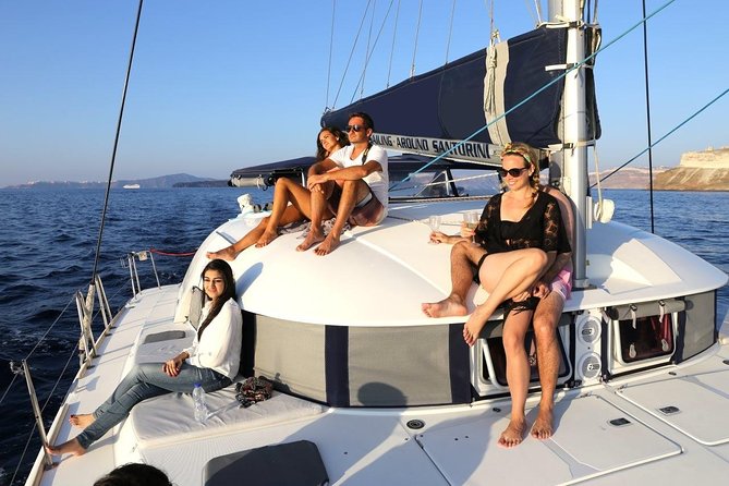 Santorini Half Day Catamaran Private Cruise incl. Meal, Drinks & Free Transport - Red Beach and White Beach by water