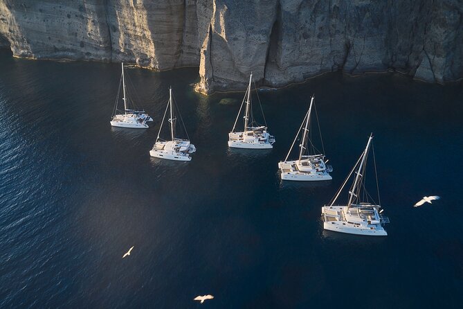 Santorini: Luxury Catamaran Cruise with Fresh Fish BBQ & Drinks - The volcano and sulfur springs