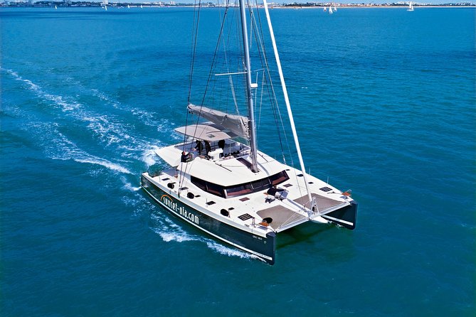 Santorini Luxury Catamaran Day Cruise with BBQ,drinks,transfer - Why seeing Santorini from the water matters