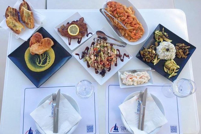 Santorini Luxury Catamaran Day Cruise with BBQ,drinks,transfer - Ancient Lighthouse views from the sea