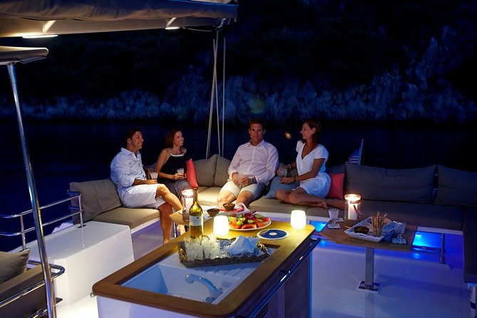 Santorini Luxury Catamaran Sunset Cruise with BBQ, Drink and Transfer - White Beach, Barbecue, and More Time in the Water