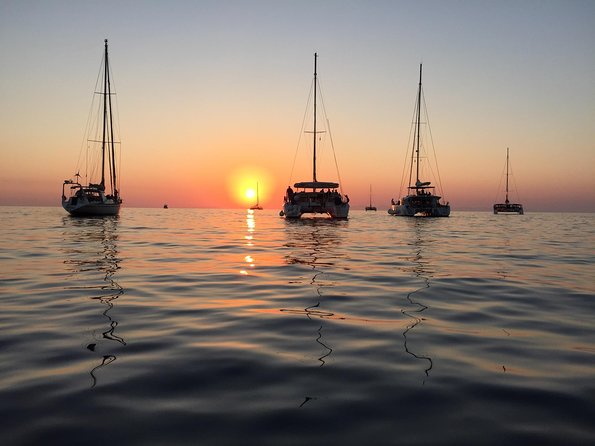 Santorini Luxury Catamaran Sunset Cruise with BBQ, Drink and Transfer - The Sunset Finish