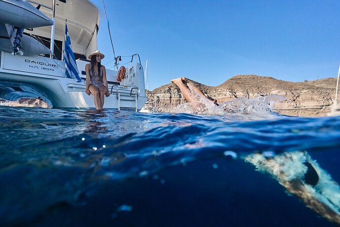 Santorini Oia: Luxury Sunset Cruise with Fresh Fish BBQ & Drinks - Red Beach, White Beach, and dinner on board