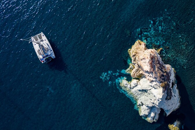 Santorini Platinum Catamaran Cruise with Meal, BBQ and Open Bar - Leaving Vlichada for the southern coast