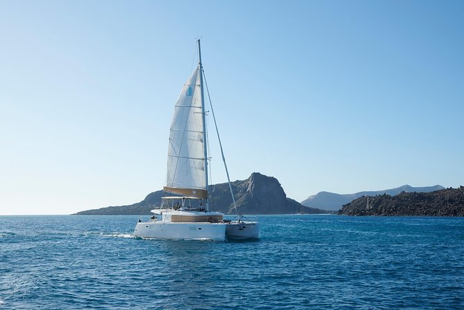 Santorini Platinum Catamaran Cruise with Meal, BBQ and Open Bar - Sunset, music, and the social mood onboard