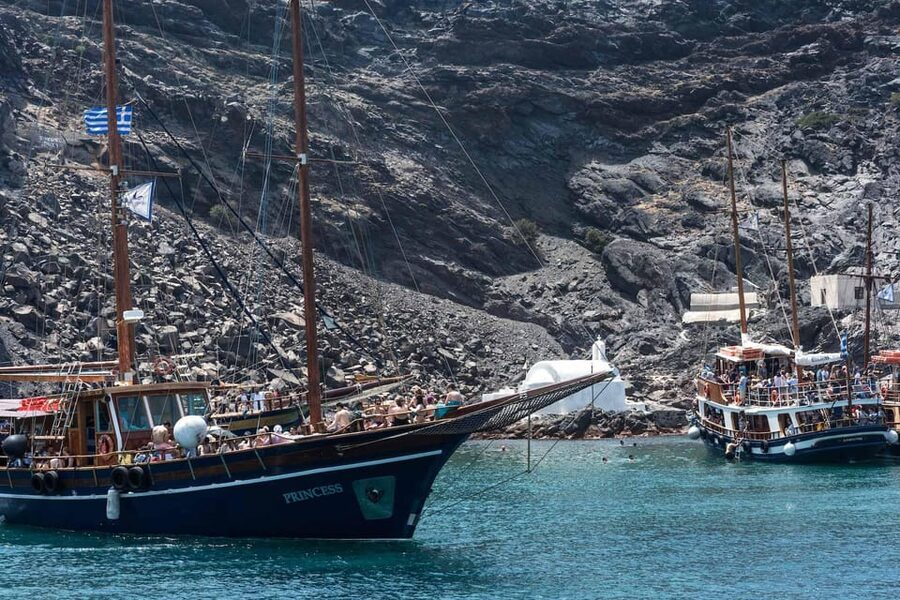 Santorini Port: Cruise to Volcano, Hot Springs & Thirassia - The return sail past Oia and Fira