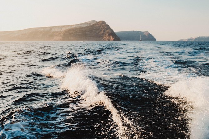Santorini Private Catamaran Cruise with BBQ, Open Bar & Transfers - Indian Rocks and the lighthouse: geology from the deck