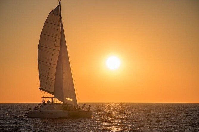 Santorini Private Catamaran Cruise with BBQ, Open Bar & Transfers - White Beach and Mesa Pigadia: the best time for swimming