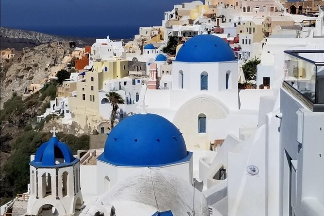 Santorini Private Driver: Explore Santorini - Port & Hotel Pickup - Fira’s Three Bells is a fast photo stop