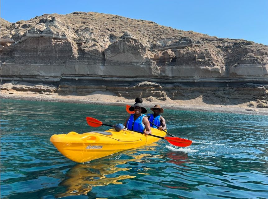Santorini: Sea Caves Kayak Trip with Snorkeling and Picnic - Entering the blue-lit sea caves