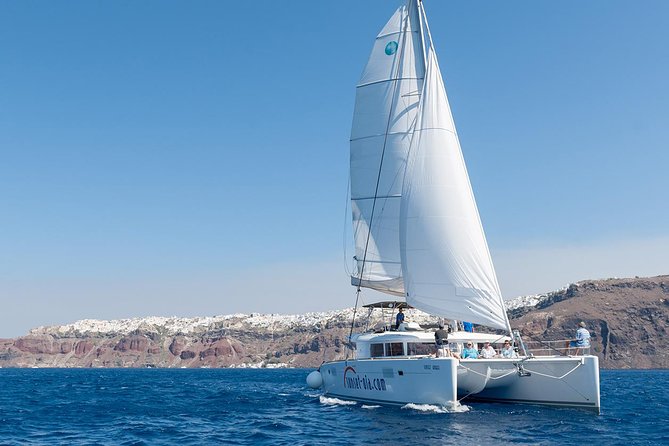 Santorini Small-Group Catamaran Sailing Trip(BBQ,drinks, transfer) - Red Beach, where the rock does the talking