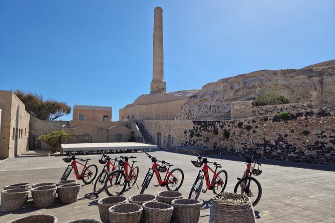 Santorini Small Group Guided E-bike Tour & Local Tomato Museum - Perissa’s black sand and volcanic shore