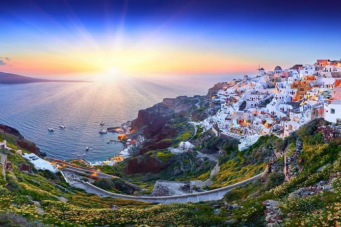 Santorini Sunset Dinner Cruise Including Nea Kameni Visit - Sunset from the water near Thirasia