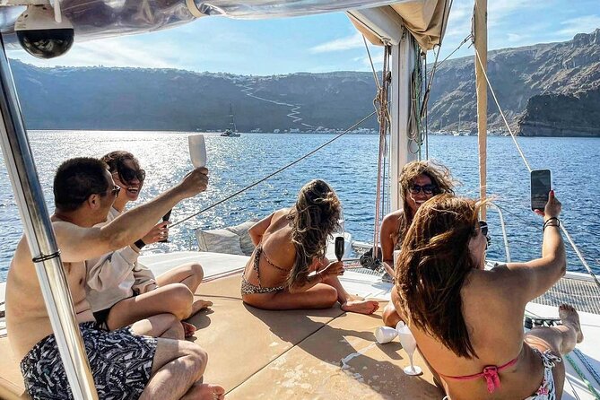 Santorini Sunset Sailing Cruise: Dinner, BBQ, Open Bar, Transfers - White Beach, Indian Rocks, and the Venetian Lighthouse
