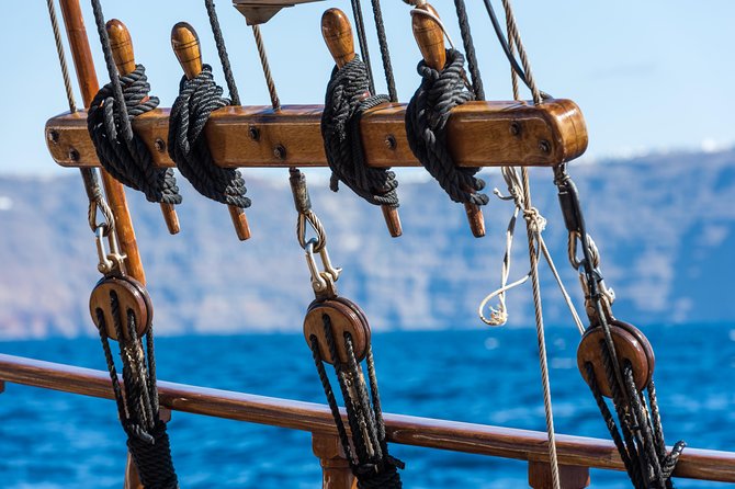 Santorini Volcano and Hot Springs Cruise Tour from Fira Old Port - What the boat ride adds to the experience