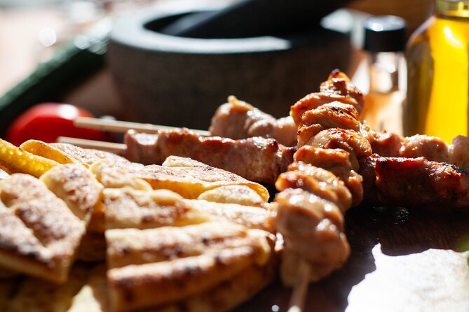 Souvlaki Cooking Class with Locals – Transfer Included - Greek white wine and the shared table