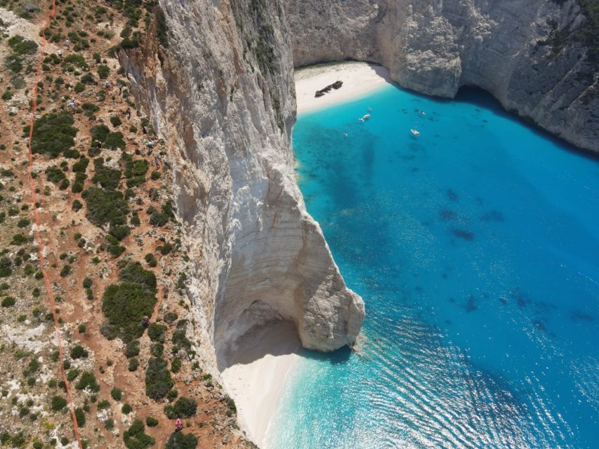 Zakynthos: West Coast & Navagio Bay Cruise with 2 Swim Stops - Navagio and the changing Shipwreck Beach